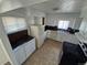 The kitchen has ample counter space, white cabinetry, and modern appliances at 1303 Havana St, Aurora, CO 80010