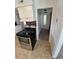 This eat-in kitchen includes stainless steel appliances and tile floors at 1303 Havana St, Aurora, CO 80010
