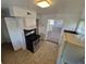 This eat-in kitchen includes stainless steel appliances and tile floors at 1303 Havana St, Aurora, CO 80010
