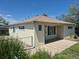 Single story home features windows, a concrete porch and a fenced yard at 1303 Havana St, Aurora, CO 80010