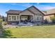Charming backyard featuring an outdoor kitchen and patio, perfect for gatherings and relaxing at 360 Basilwood Way, Highlands Ranch, CO 80126