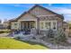 Outdoor patio with built-in grill and picturesque landscaping makes this home great for outdoor living at 360 Basilwood Way, Highlands Ranch, CO 80126