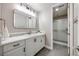 Bright bathroom featuring a white vanity and a glass shower at 360 Basilwood Way, Highlands Ranch, CO 80126