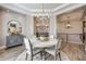 Cozy dining area featuring a round table, stylish decor, and an open layout, perfect for gatherings at 360 Basilwood Way, Highlands Ranch, CO 80126