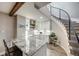 Contemporary kitchen with granite countertops, white cabinetry, a staircase and modern stainless steel appliances at 360 Basilwood Way, Highlands Ranch, CO 80126