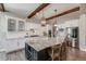 Spacious kitchen featuring white cabinets, stainless steel appliances, a large island, and stylish pendant lighting at 360 Basilwood Way, Highlands Ranch, CO 80126