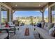 Enjoy this outdoor living area with a built-in grill, comfortable seating, and a cozy fireplace at 360 Basilwood Way, Highlands Ranch, CO 80126