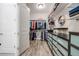 Spacious walk-in closet with custom shelving, drawers, and wood-style flooring, offering ample storage space at 360 Basilwood Way, Highlands Ranch, CO 80126