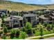 Aerial view of luxury homes surrounded by lush landscaping, showcasing the upscale community and greenery at 9395 Night Star Pl, Lone Tree, CO 80124