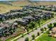 A neighborhood featuring luxury houses on tree-lined streets situated next to beautiful hillside at 9395 Night Star Pl, Lone Tree, CO 80124