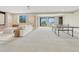 Large finished basement featuring a seating area and a ping pong table, great for recreational activities at 9395 Night Star Pl, Lone Tree, CO 80124
