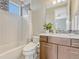 Contemporary bathroom boasts a neutral color scheme, and a stylish shower-tub combo at 9395 Night Star Pl, Lone Tree, CO 80124