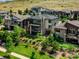 Beautiful two-story home with a stone chimney, balconies, and a well-maintained lawn at 9395 Night Star Pl, Lone Tree, CO 80124