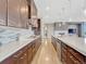 Modern kitchen with stainless steel appliances, a large island, and sleek cabinetry at 9395 Night Star Pl, Lone Tree, CO 80124