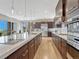 Spacious gourmet kitchen with a large island, modern appliances, and ample counter space at 9395 Night Star Pl, Lone Tree, CO 80124