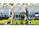 Aerial view of a backyard with a well-manicured lawn, patio, and lush landscaping, perfect for outdoor enjoyment at 17955 E 107Th Pl, Commerce City, CO 80022