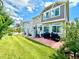 The backyard features a well-kept lawn, grilling area, deck and lush plants offering a beautiful retreat at 17955 E 107Th Pl, Commerce City, CO 80022