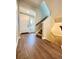 Inviting entryway featuring hardwood floors, stairs, and a bright white front door welcoming you home at 17955 E 107Th Pl, Commerce City, CO 80022