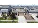 Beautiful two-story home with a large driveway, well-manicured lawn, and appealing landscaping at 17955 E 107Th Pl, Commerce City, CO 80022