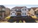 Picture of a two story home with a wooden fence and a covered patio area overlooking the landscaped backyard at 751 Green Mountain Dr, Erie, CO 80516