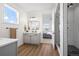 Bathroom with stylish vanity, modern lighting, shower and an adjacent bedroom view at 751 Green Mountain Dr, Erie, CO 80516