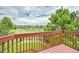 Enjoy the view from this spacious back deck with lush greenery and scenic landscaping at 2252 S Queen St, Lakewood, CO 80227