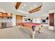 Finished basement features a pool table, dry bar with wine storage, and custom lighting at 2252 S Queen St, Lakewood, CO 80227