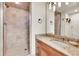 Bathroom featuring tile shower, granite counters, a vessel sink, and decorative lighting at 2252 S Queen St, Lakewood, CO 80227
