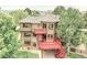 Beautiful home featuring multiple decks, large windows, and lush landscaping, offering a serene and private outdoor space at 2252 S Queen St, Lakewood, CO 80227