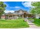 Beautiful home with well-manicured lawn and landscaping, showcasing curb appeal at 2252 S Queen St, Lakewood, CO 80227