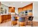 Spacious kitchen featuring custom wood cabinets, granite countertops, and modern stainless steel appliances at 2252 S Queen St, Lakewood, CO 80227