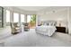 Serene main bedroom with balcony access, plush carpeting, and ample natural light create a relaxing retreat at 2252 S Queen St, Lakewood, CO 80227