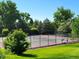 Well-maintained tennis courts surrounded by lush greenery, providing an inviting space for recreational activities at 2252 S Queen St, Lakewood, CO 80227