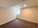 A cozy and carpeted basement bedroom with a small window for natural light at 8426 W Woodard Dr, Lakewood, CO 80227
