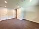 Finished basement with new carpet and ample space for recreation or storage at 8426 W Woodard Dr, Lakewood, CO 80227