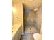 Updated bathroom featuring tiled shower and neutral color scheme at 8426 W Woodard Dr, Lakewood, CO 80227