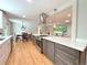 Bright, open kitchen showcasing island and stainless appliances with an open floorplan at 8426 W Woodard Dr, Lakewood, CO 80227