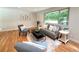 Comfortable living room with plush seating, soft rug, and a large window view at 8426 W Woodard Dr, Lakewood, CO 80227