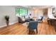 Open living area featuring hardwood floors, neutral tones, and seamless flow at 8426 W Woodard Dr, Lakewood, CO 80227