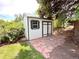 Charming backyard shed with new paint, windows and stone base at 8426 W Woodard Dr, Lakewood, CO 80227