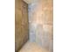 Contemporary shower featuring stylish gray tiling and hexagonal tile flooring at 8426 W Woodard Dr, Lakewood, CO 80227