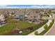 A high angle of a property boasting a spacious backyard, patio area, and a secure wooden fence in a suburban setting at 13205 E 109Th Ave, Commerce City, CO 80022