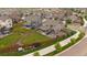 Overhead shot of a home featuring a green backyard, outdoor living space, and a fenced perimeter within a residential area at 13205 E 109Th Ave, Commerce City, CO 80022