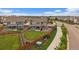 Aerial view of the backyard featuring a well-maintained lawn, fence, and landscaping at 13205 E 109Th Ave, Commerce City, CO 80022