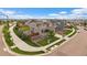 Aerial view of a two-story home with solar panels and a fenced backyard in a suburban neighborhood at 13205 E 109Th Ave, Commerce City, CO 80022