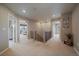 Upstairs hallway with neutral carpet that leads to various bedrooms at 13205 E 109Th Ave, Commerce City, CO 80022
