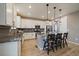 Kitchen with stainless steel appliances, granite countertops, and center island with pendant lighting and bar stool seating at 13205 E 109Th Ave, Commerce City, CO 80022