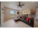 Spacious living room with wood-like floors, stairs, and an open view to the kitchen at 13205 E 109Th Ave, Commerce City, CO 80022