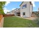 Well-maintained backyard with a lush lawn, patio, and stairs leading to an upper deck at 756 Ranchhand Dr, Berthoud, CO 80513