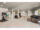 Expansive basement offers a leisure area with a comfortable leather sectional and play area at 756 Ranchhand Dr, Berthoud, CO 80513